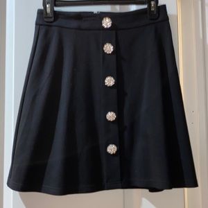 Black mini skirt with crystal buttons